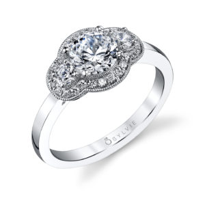 Unique Three-Stone Halo Diamond Engagement Ring Classic three stone diamond engagement ring with a milgrain accented halo