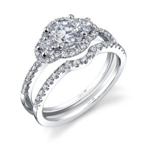 Classic Petite Three-Stone Diamond Engagement Ring Three stone diamond engagement ring with a simple halo styling
