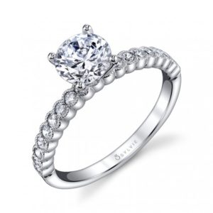Brilliant Round Diamond Engagement Ring with Beaded Milgrain Detail Four prong diamond engagement ring with milgrain accented bezel set accent stones