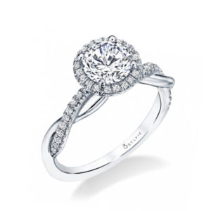 Halo style diamond engagement ring with a twisting diamond and plain gold shank